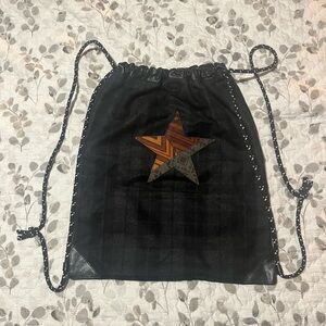 Il Bisonte black leather and wool blend drawstring backpack with a star design